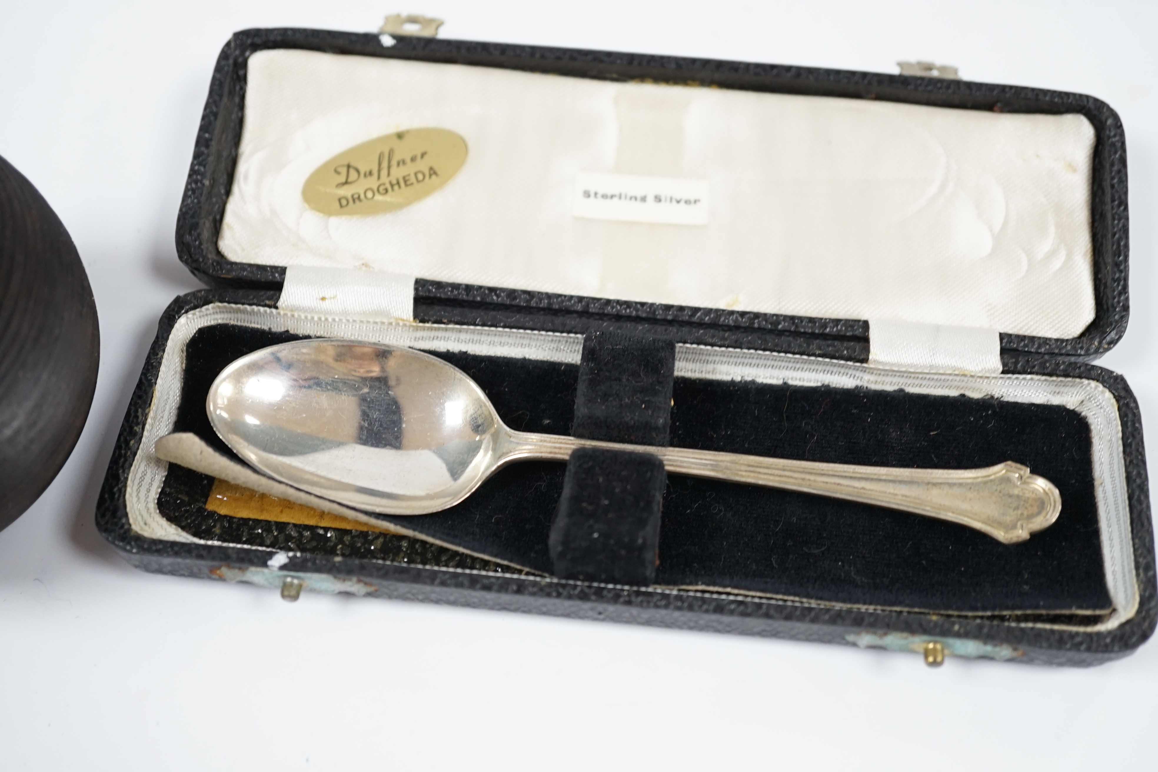 Sundry small silver including a modern mounted wooden match tidy, a George V bracelet, pair of menu holders and cased spoon. Condition - fair